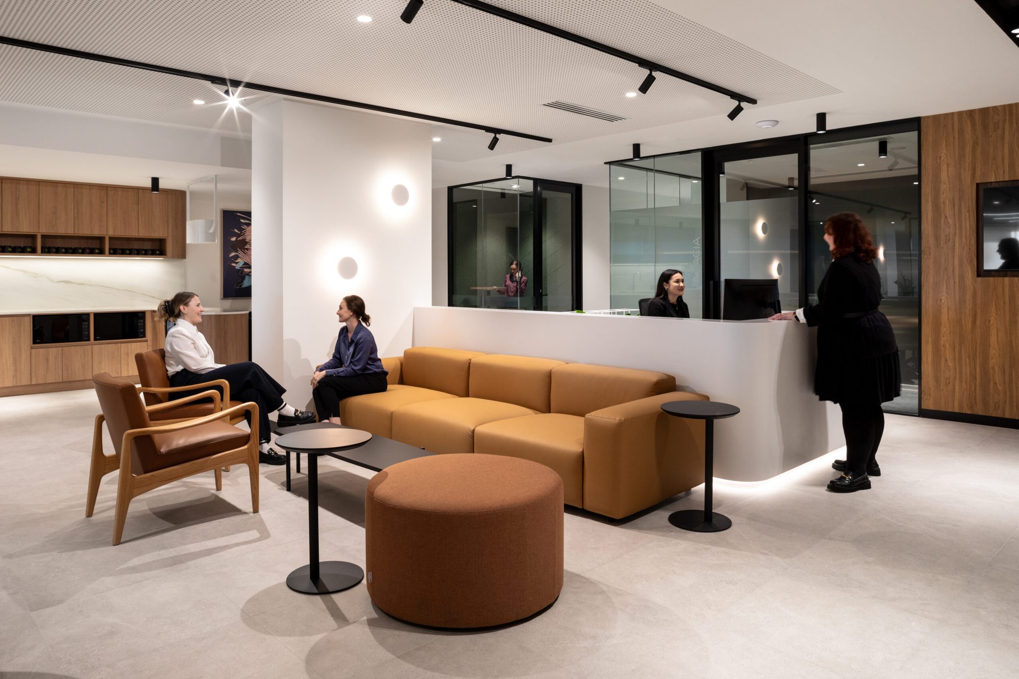 Reception desk and client lounge with glass-walled offices in a serviced office at 143 St Georges Terrace, Perth